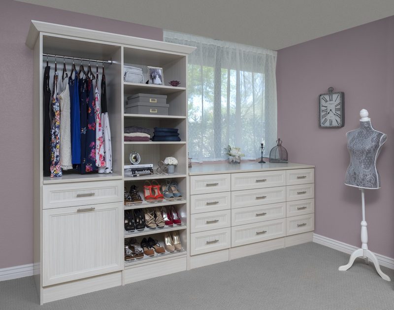 Custom reach-in closet system with ODI cabinetry by Closet Concepts