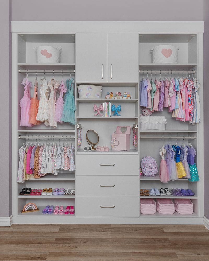 Custom reach-in closet system with ODI cabinetry by Closet Concepts