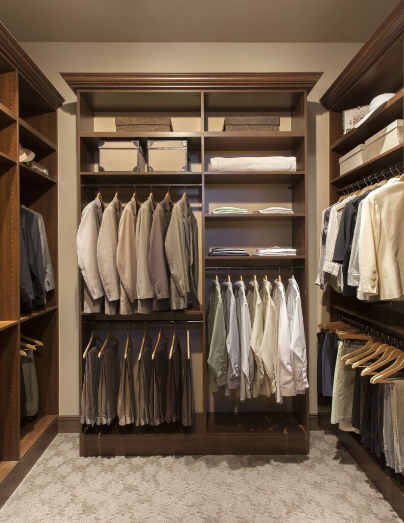 Custom reach-in closet system with ODI cabinetry by Closet Concepts