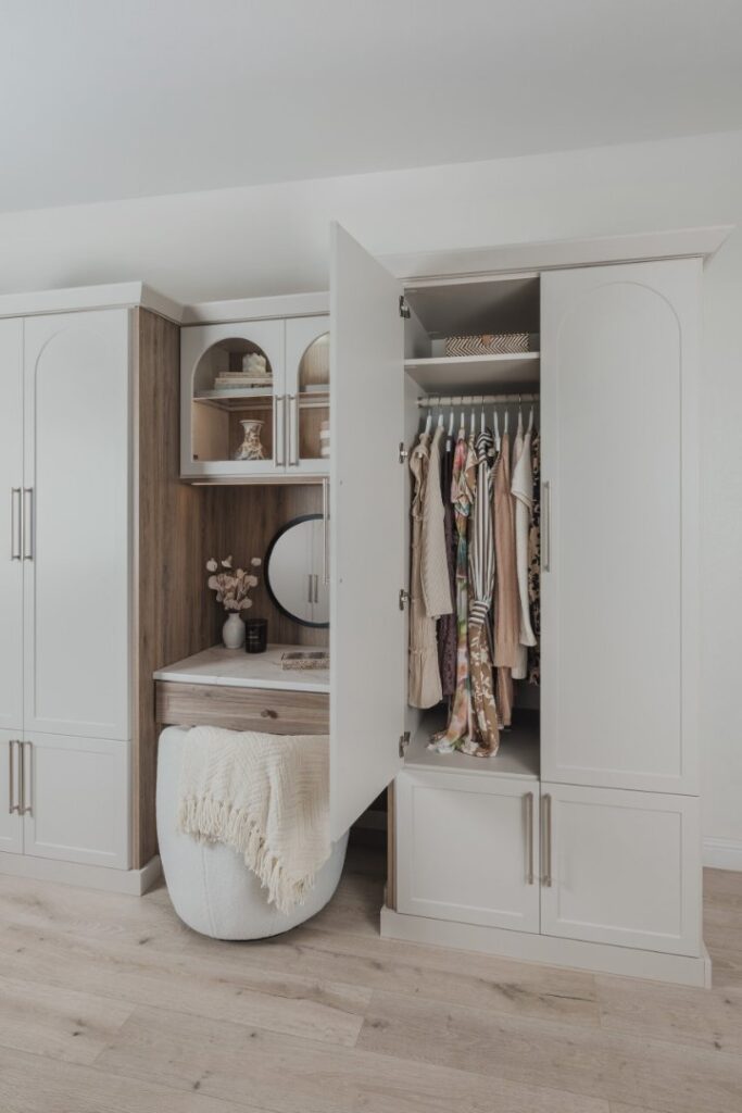 Custom reach-in closet system with ODI cabinetry by Closet Concepts