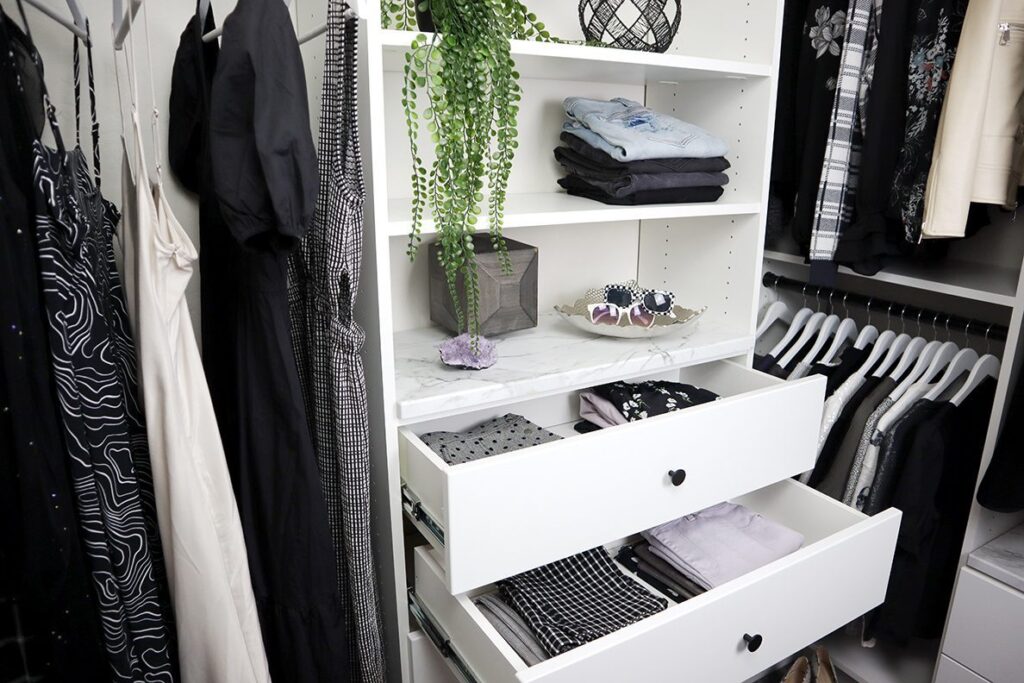 Custom walk-in closet with ODI cabinetry, designed and installed by Closet Concepts