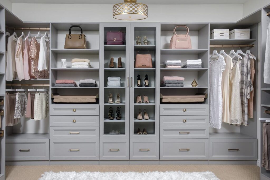 Custom walk-in closet with ODI cabinetry, designed and installed by Closet Concepts