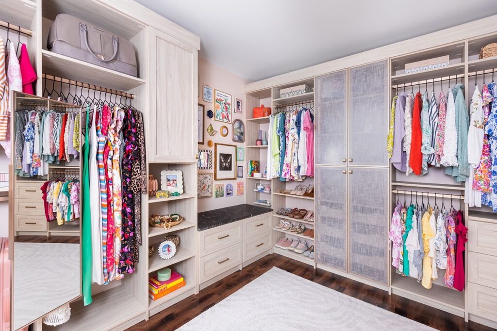 Custom walk-in closet with ODI cabinetry, designed and installed by Closet Concepts