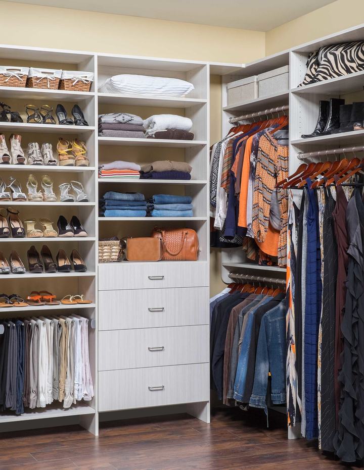 Custom walk-in closet with ODI cabinetry, designed and installed by Closet Concepts