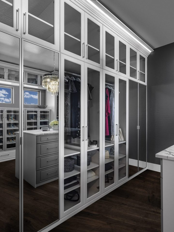 Custom walk-in closet with ODI cabinetry, designed and installed by Closet Concepts
