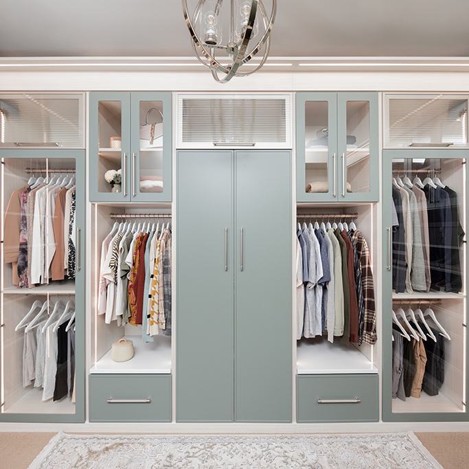 Custom walk-in closet with ODI cabinetry, designed and installed by Closet Concepts
